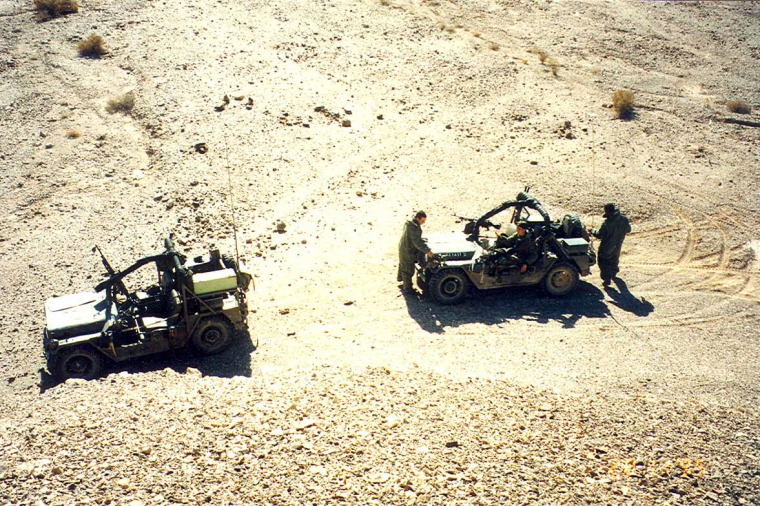 Two reconnaissance jeeps stopped during an excercise in the desert
